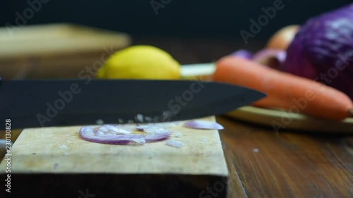 Shallot cut Shooting on the detail of the shallot cut. Cutting Shallots on Wooden Board. Slice the shallots.