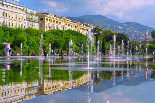 Cityscape with beautiful street fountain. Europe square in Nice.