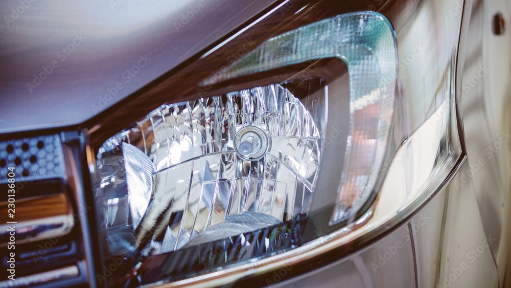 Fototapeta premium closeup view at modern car headlight. Front view