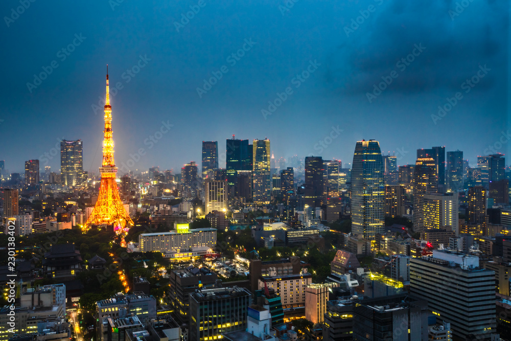 Aerial view of Tokyo Skyline at dusk with illuminated Tokyo Tower, icon and landmark of Minato Distric in Tokyo, Japan.