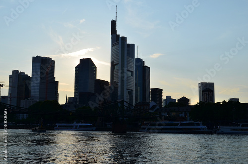 Skyscrapers by the river. Sunset. City landscape.