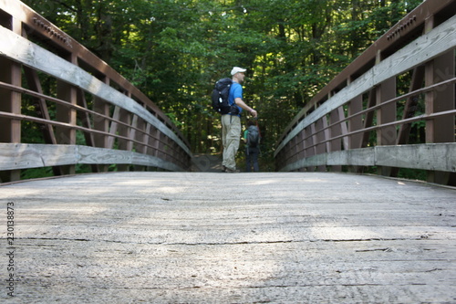 Hiker on a Bridge