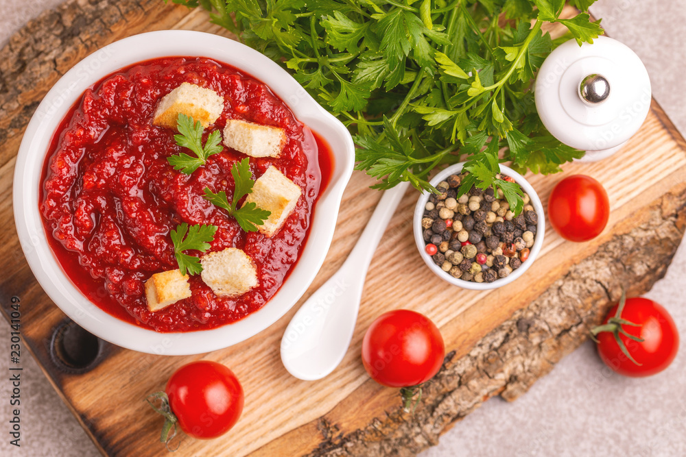 Bright fresh tasty pureed tomato soup with ingredients Bright fresh tasty pureed tomato soup with ingredients