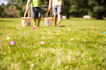 easter eggs hunt. Blurred silhouettes of children with baskets in hands. the concept of family fun at Easter.  blurred background. Cope space for your text