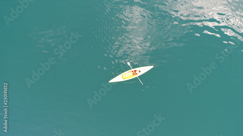 aerial top view of kayaks  over green  lake on sunny summer day © .shock