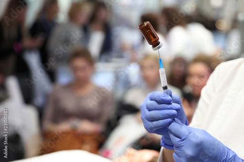 Doctor gaining in a syringe medication for mesotherapy