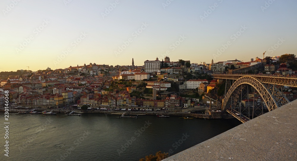 sunset at douro river in porto with bridge