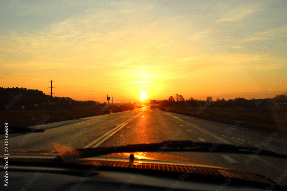 Beautiful dawn on the highway. View from the car. Background. Landscape.