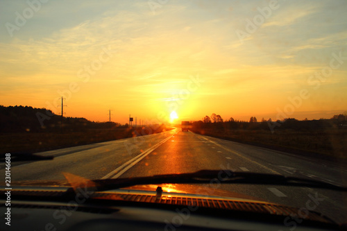 Beautiful dawn on the highway. View from the car. Background. Landscape.