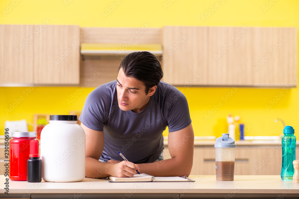Young man blogging about food supplements Young man blogging about food supplements
