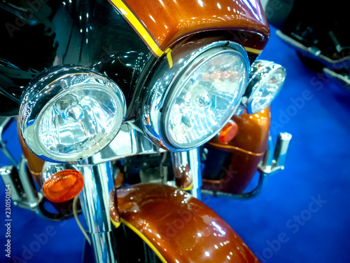Fragment of a motorcycle. Headlight motorcycle The bike. Men's hobbies. photo