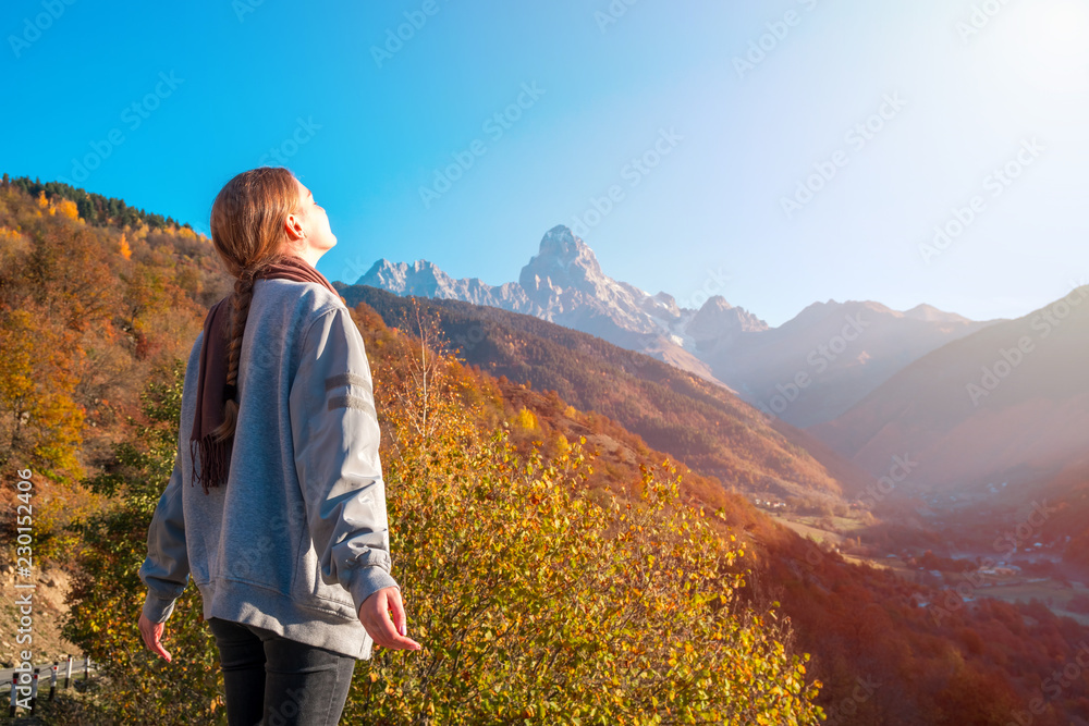 beautiful blonde girl on the background of Mount Ushba, mountains of Svaneti, Georgia beautiful blonde girl on the background of Mount Ushba, mountains of Svaneti, Georgia