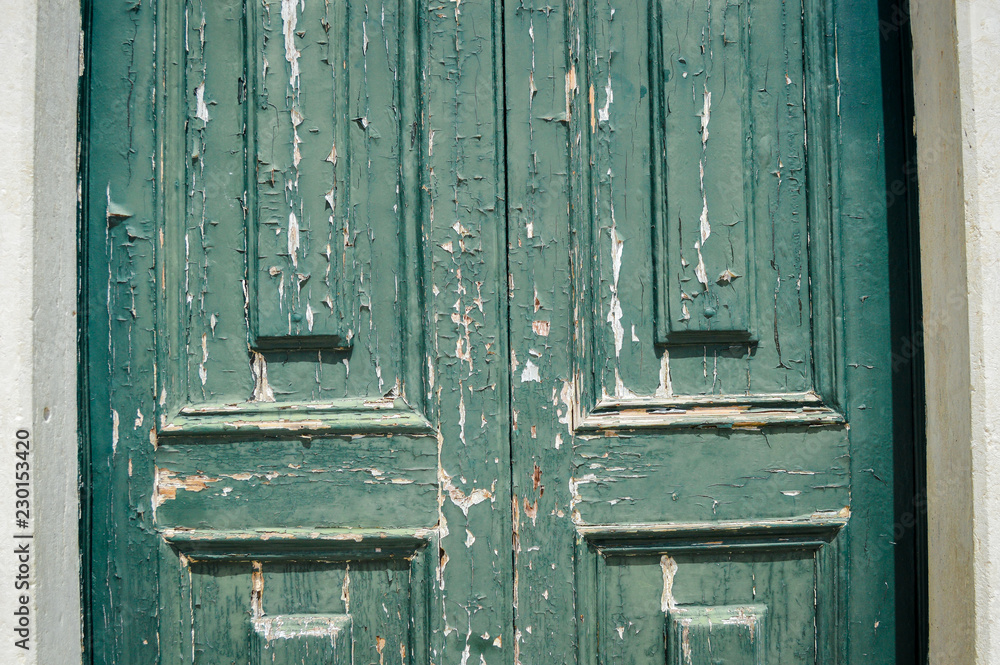 Old woden door textured grungy background, closeup.