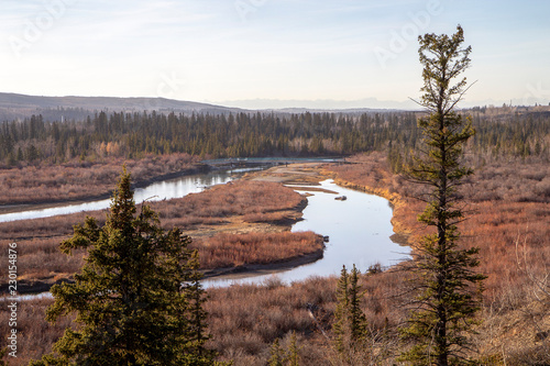 View over a valley with creeks, forest and mountains in the back, Glenmore Park, Calgary, Alberta, Canada