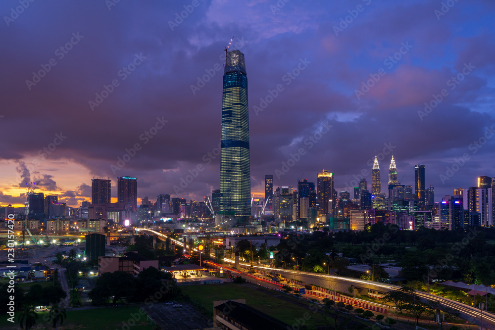 Fototapeta premium View of majestic sunset over Exchange 106 tower (formerly known as TRX Signature). The tower still under construction and will become tallest tower in Malaysia.