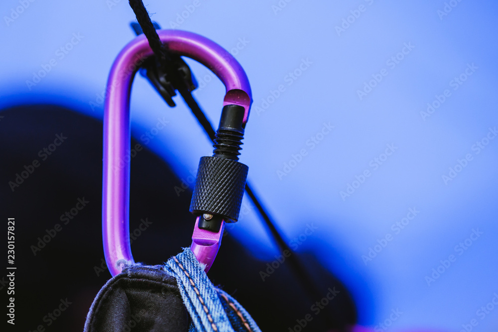 Carabiner purple and black with rope Hanging jeans. Carabiner purple and black with rope Hanging jeans.