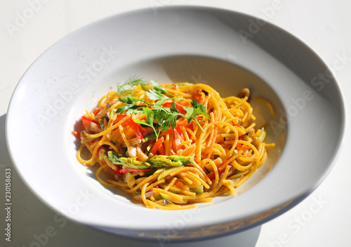 Macro photo of delicious spaghetti with vegetables