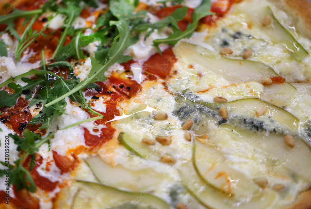 Macro photo of delicious pizza with pear and cheese Macro photo of delicious pizza with pear and cheese