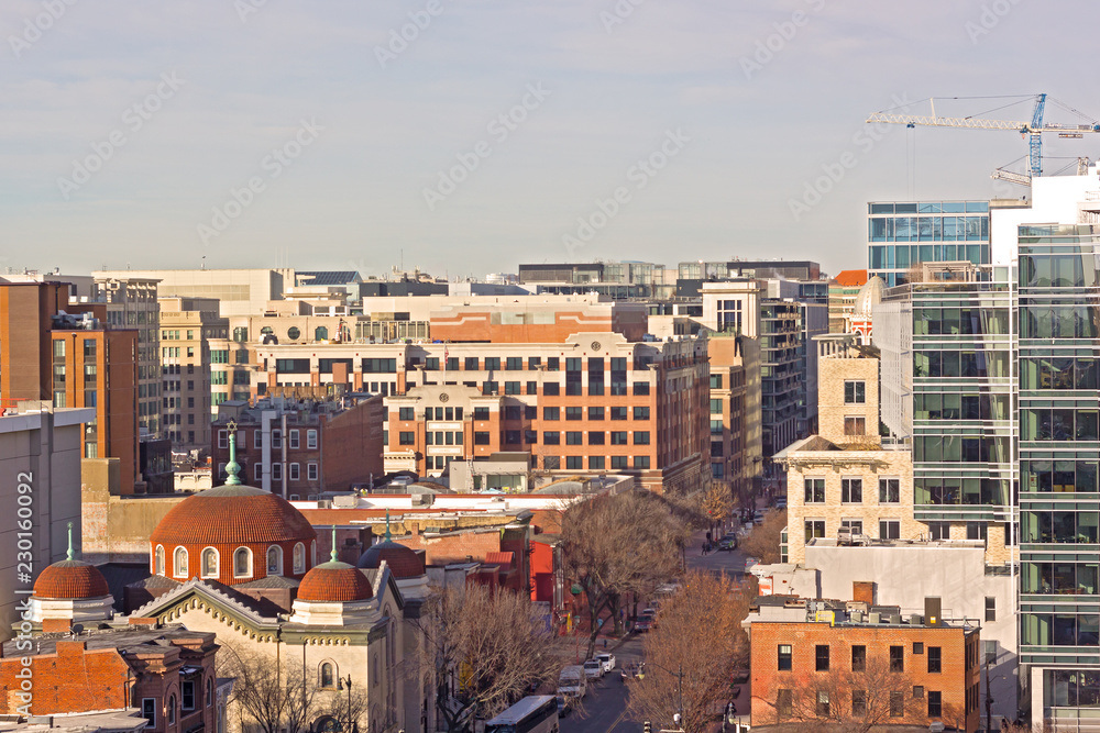 Urban panorama of US capital in Chinatown neighborhood, Washington DC, USA. Early morning landscape with modern and historic city buildings.