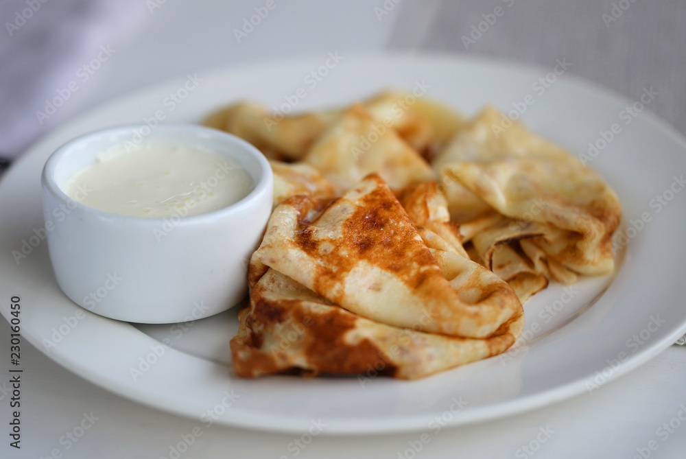 Macro photo of thin delicious pancakes with vanilla Macro photo of thin delicious pancakes with vanilla