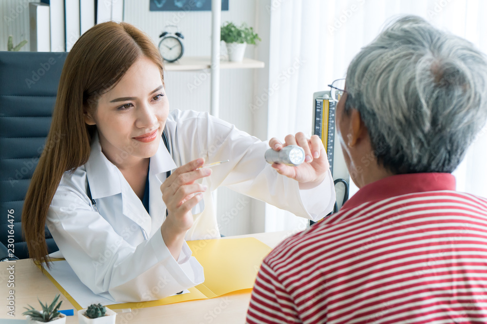 Asian woman doctor check tonsil gland of patient Asian woman doctor check tonsil gland of patient