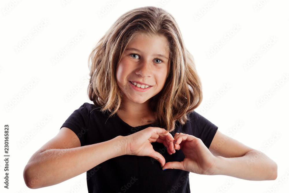 Young girl with black shirt isolated on white background in love or frustration poses i love you heart from hands over heart Young girl with black shirt isolated on white background in love or frustration poses i love you heart from hands over heart
