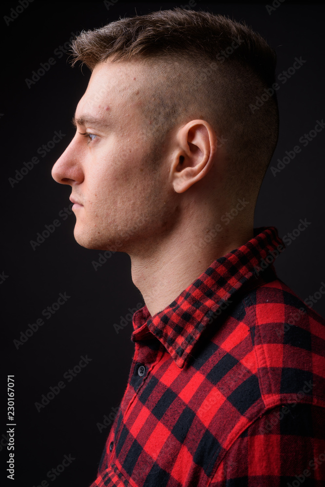 Profile view of serious young handsome man face Profile view of serious young handsome man face