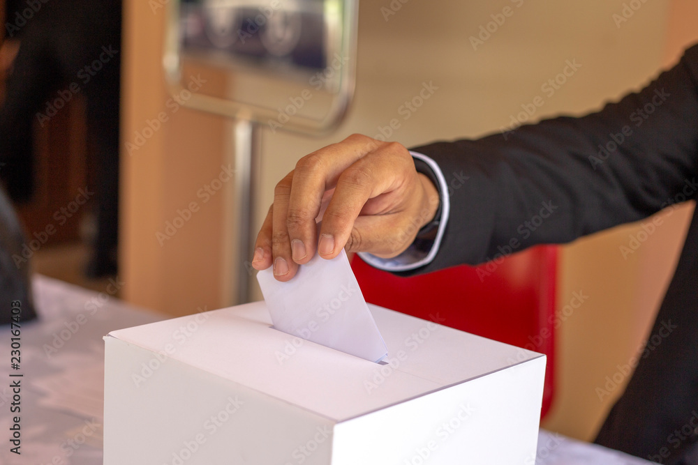 a man put white paper in election box a man put white paper in election box