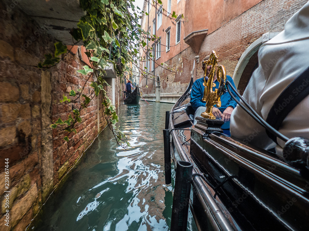 The serenity of a gondola ride in beautiful Venice.