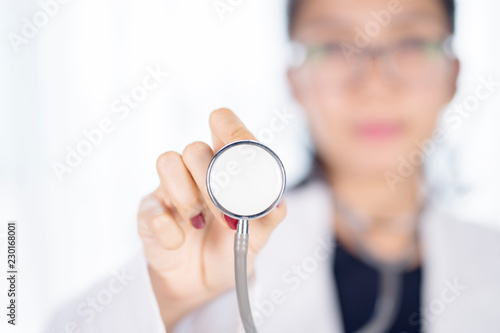 Female doctor with stethoscope on her hand