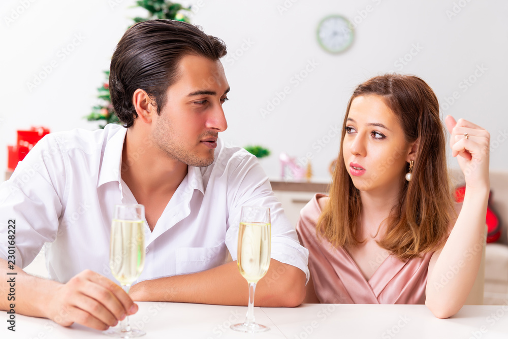 Young pair conflicting at christmas night Young pair conflicting at christmas night