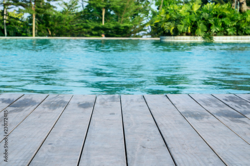 Wooden floor of swimming pool at tropical resort