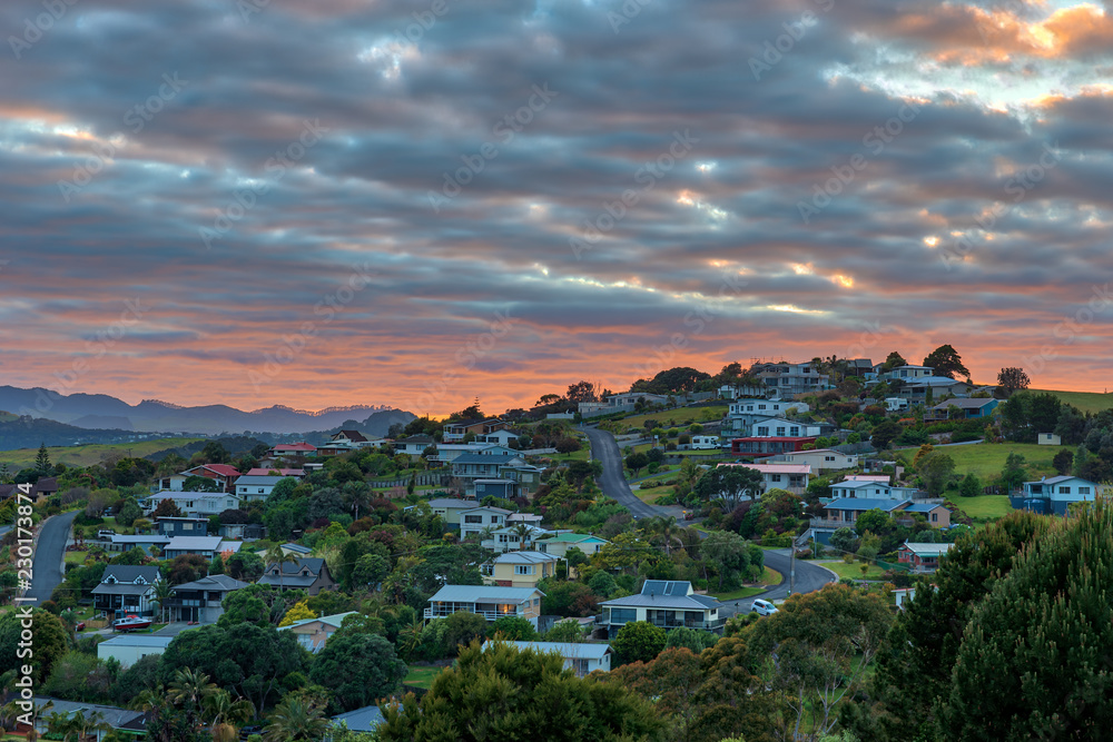 colorful sunrise over mangonui town in New Zealand