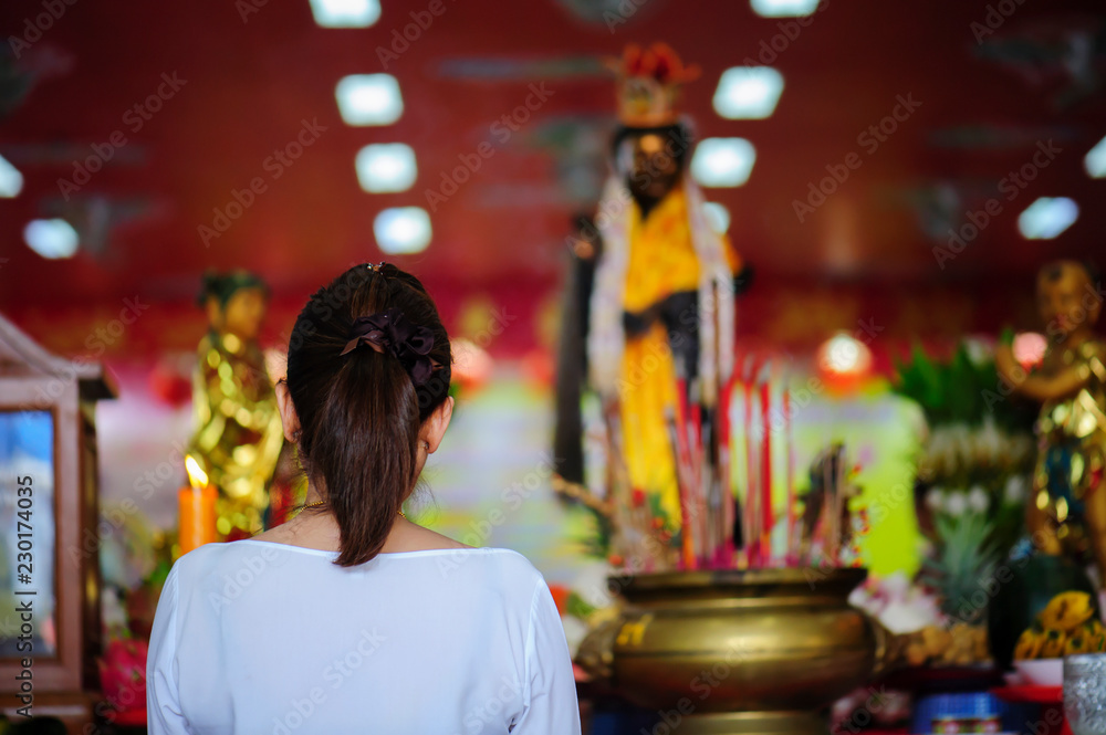Chinese Buddhists worship Goddess Kuan Yin in the shrine Chinese Buddhists worship Goddess Kuan Yin in the shrine