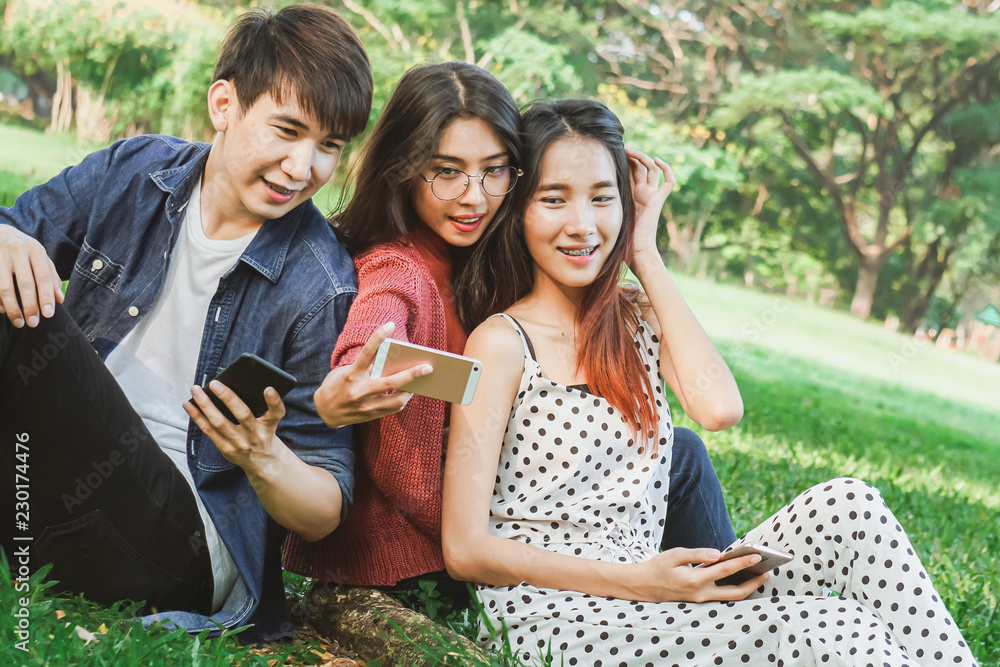 Asian student selfies in park with friend Asian student selfies in park with friend