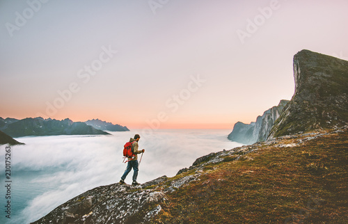 Photography Man adventurer exploring sunset mountains hiking with backpack Traveling heathy