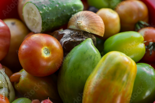 Set of fresh tomatoes and other vegetables.