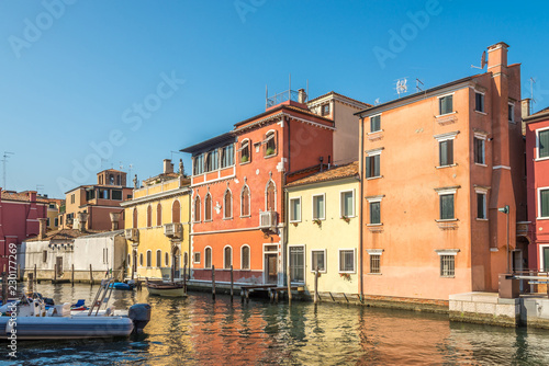 View at the colored buildings on the Vean canal in Chioggia - Italy