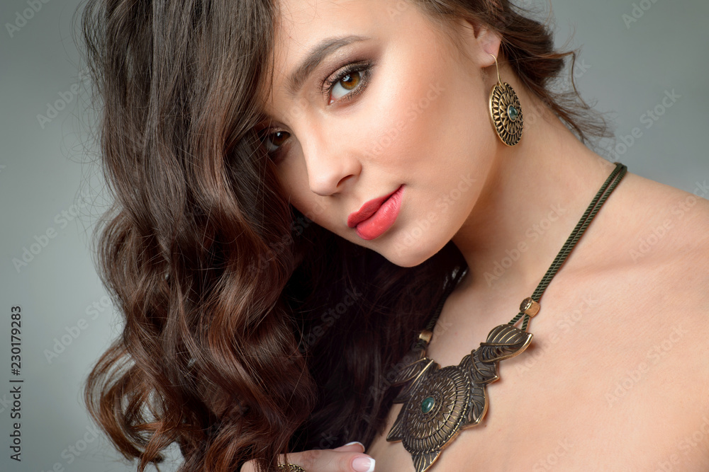 close-up studio portrait model demonstrate necklace and earring