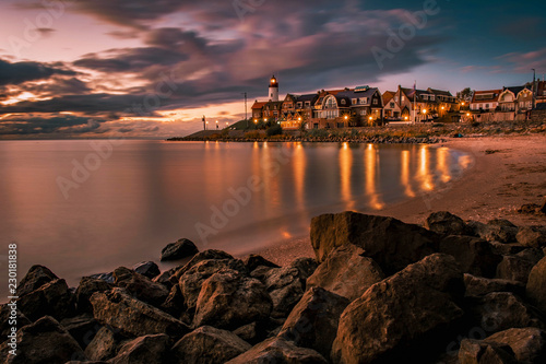 Urk lighthouse during sunset at night, evening dus over Urk Flevoland Netherlands former Island  photo