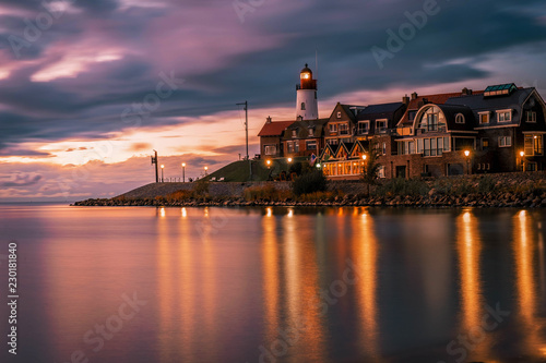 Urk lighthouse during sunset at night, evening dus over Urk Flevoland Netherlands former Island  photo