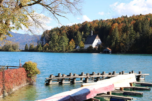 Jetty with old house across water at Lake Walchensee in Bavaria-Germany in autumn 3573