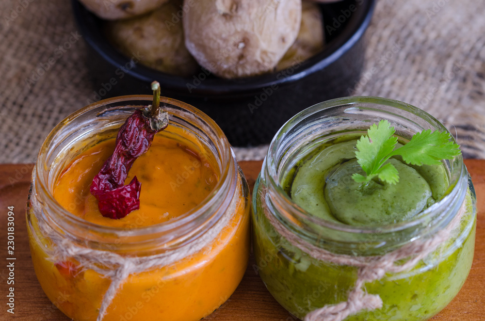 Φωτογραφία Two most popular Canary Islands popular sauses Mojo picon (Red hot sause) and  Mojo verde (Green sause) are usually eaten with Papas Arrugadas (wrinkly potatoes)