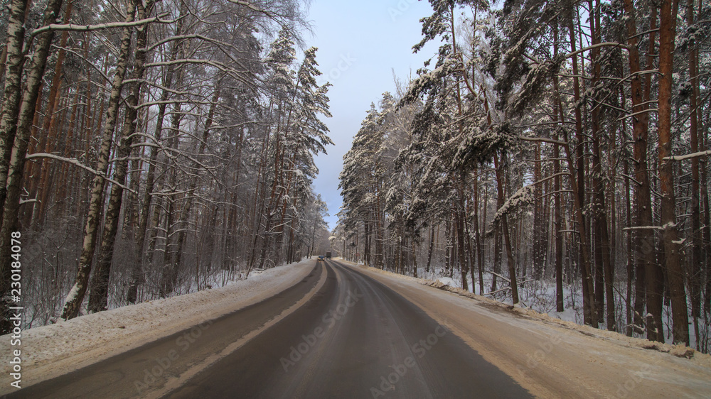 Snow road in the forest in winter Snow road in the forest in winter