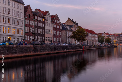 Sunset in Copenhagen on an old canal with boats and houses reflecting in the calm waters - 7 © gdefilip