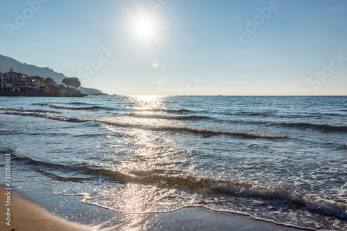 Fototapeta Naklejka Na Ścianę i Meble -  Sun and Turquoise Blue Water on a Southern Italian Mediterranean Beach