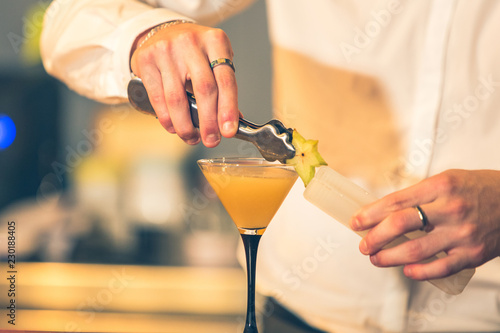 Barman preparing a cocktail photo