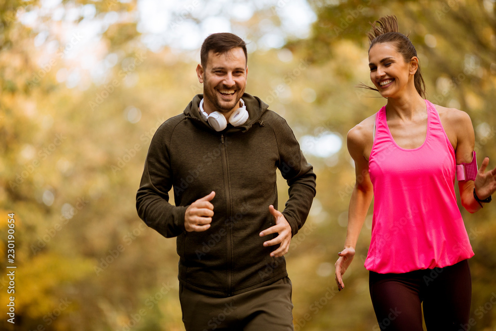 Fototapeta premium Young people jogging and exercising in nature