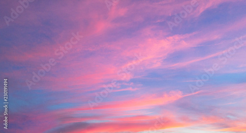 Beautiful pastel cloudy sunset with blue sky  © roxana_stefania