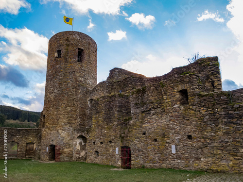 The ruins of Reuland Castle just before a November sunset at Burg-Reuland Belgium